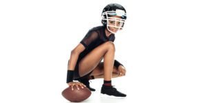 Girl in American football gear